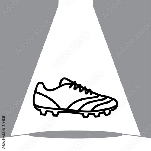 Spotlit Football Boot a Symbol of Athletic Prowess and Sporting Goods Excellence in Dynamic Black and White