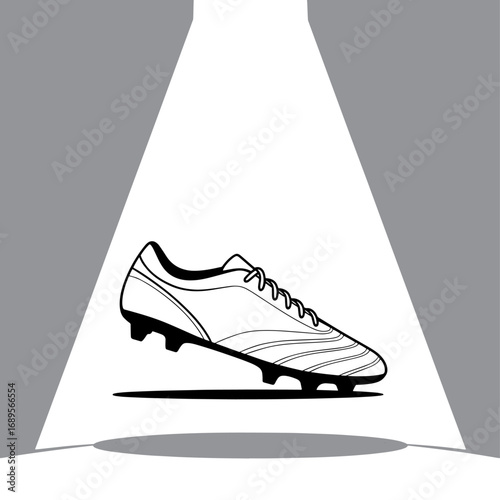 Spotlit Football Boot a Symbol of Athletic Prowess and Sporting Goods Excellence in Dynamic Black and White