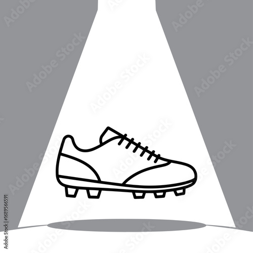 Spotlit Football Boot a Symbol of Athletic Prowess and Sporting Goods Excellence in Dynamic Black and White