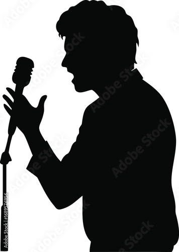 Dynamic silhouette of a male performer speaking passionately into a vintage microphone on stage silhouette