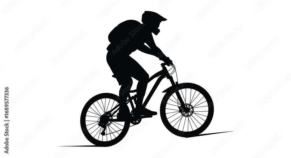 Obraz premium a cyclist in motion riding a mountain bike silhouette