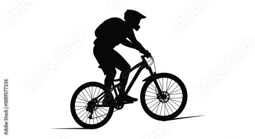 a cyclist in motion riding a mountain bike silhouette