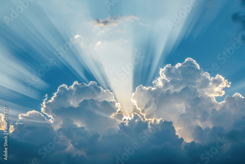 Heavenly light rays shining through soft clouds in a peaceful sky