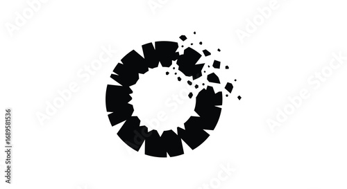 a fragmented circular shape with scattered pieces around it