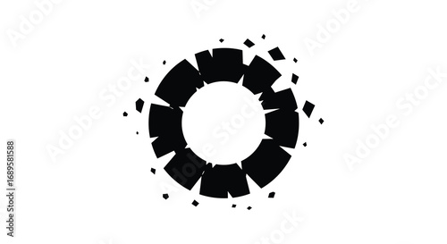a shattered circular shape with fragmented pieces scattered around