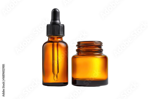 Two amber glass bottles, one with a dropper top, the other open,  suggesting skincare or cosmetic products.  A studio shot highlights the textures and colors