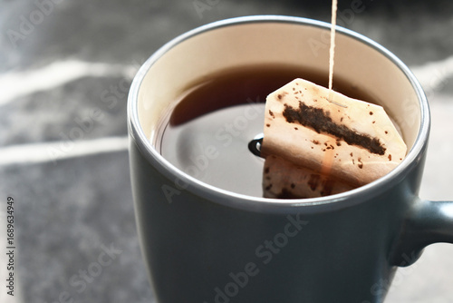 Tea bag in a tea cup. Healthy herbal tea in a mug.