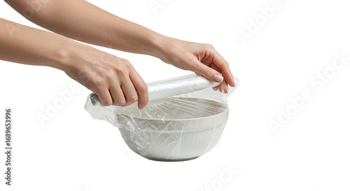 Plastic wrap applied to bowl by hands, food packaging, transparent background, studio photo, PNG.