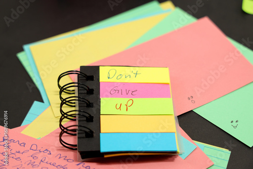 sticky note that says, don't give up