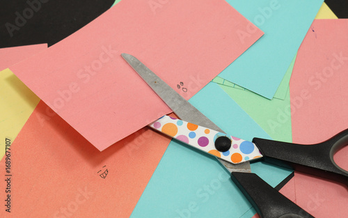 school scissors cutting colored paper