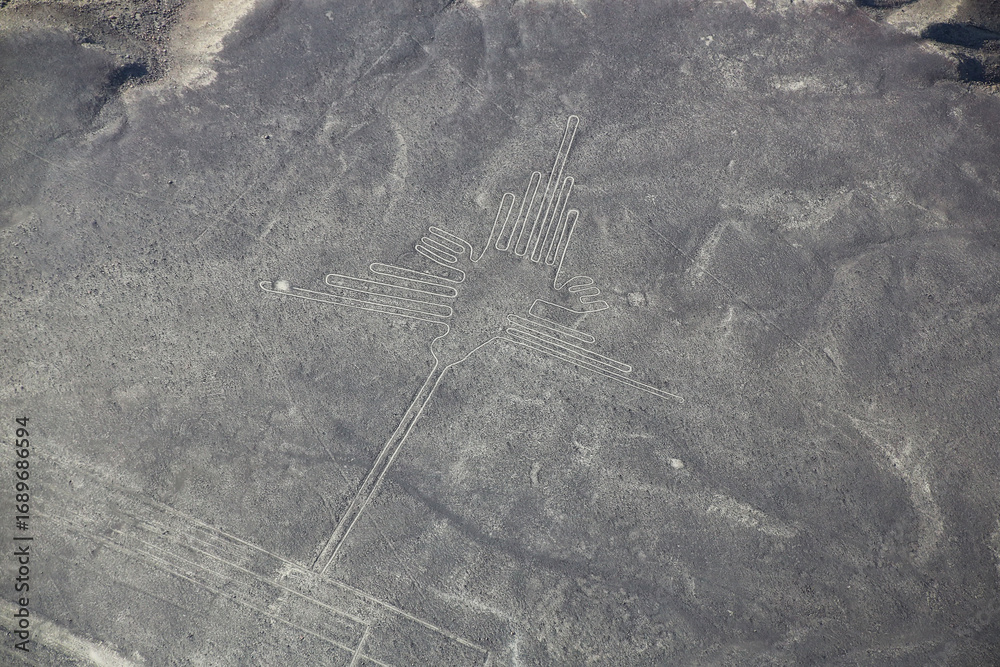 Naklejka premium Aerial view of Nazca Lines - Hummingbird geoglyph, Peru.