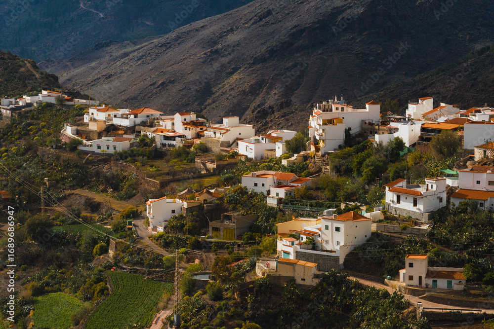 Naklejka premium charming town in the mountains of Gran Canaria at sunset