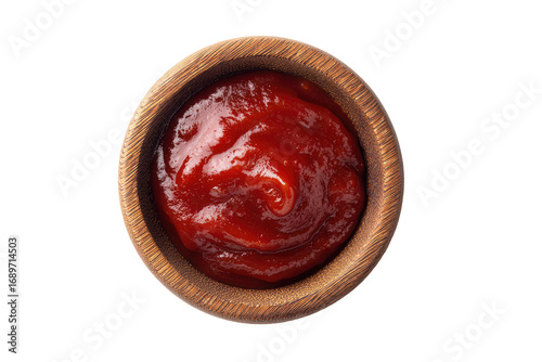 Wooden bowl filled with a rich, vibrant red sauce