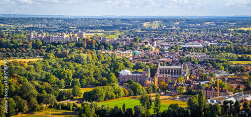 Aerial view of Eton College and surrounding historic town buildings with green fields