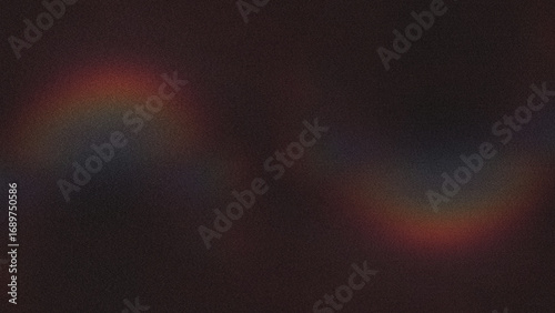 Dark speckled texture reveals subtle rainbow flares. Creates depth for cinematic video backdrops or creative design templates.