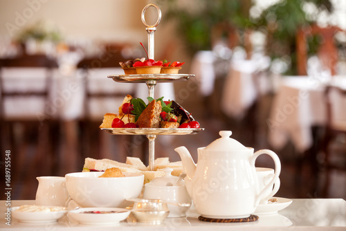 Traditional British afternoon high tea with delicious treats and fine tea.