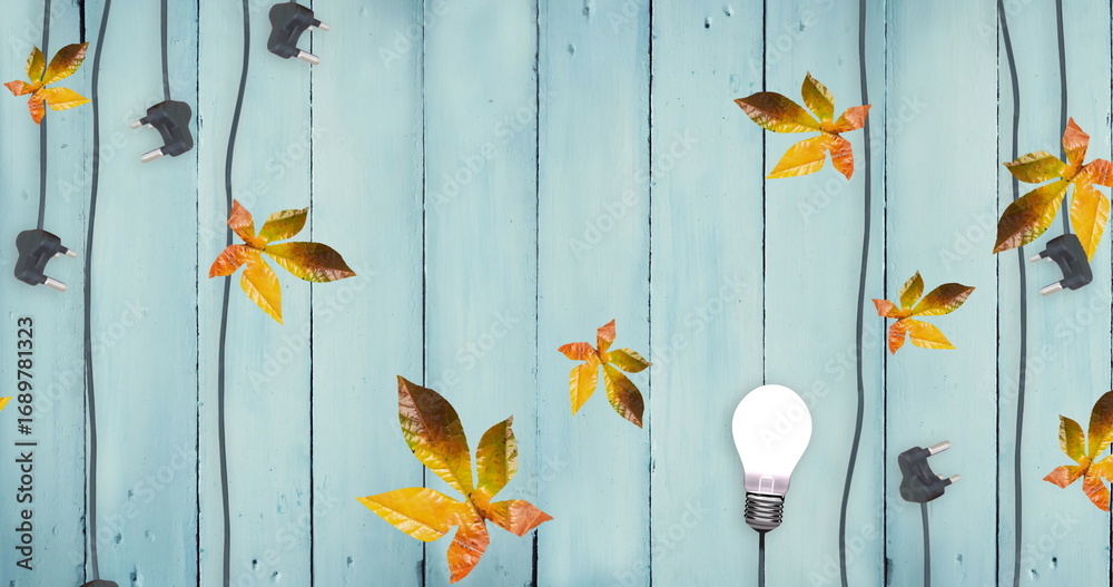 Obraz premium Image of autumn leaves on blue wooden boards