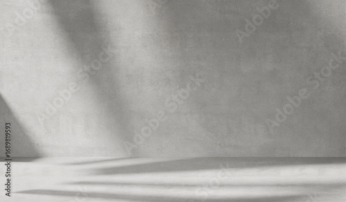 Gray background with cement wall texture. Minimalist abstract background for product presentations with soft shadows from the window