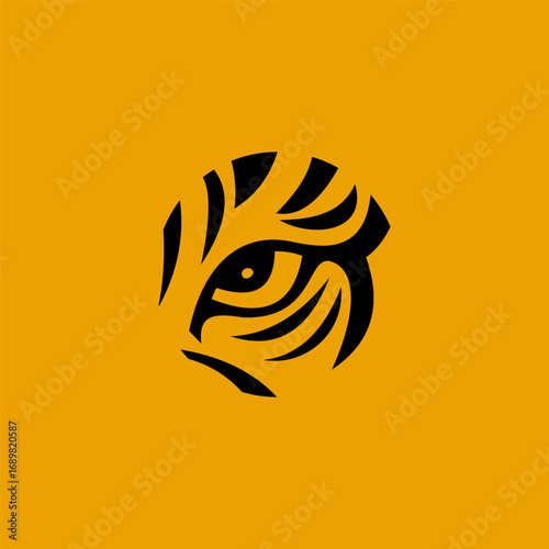 Tiger eye logo design, stylized tiger eye in a circle, black and yellow background.
