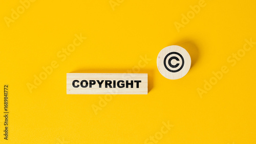 Fotografie The word copyright and copyright symbol on wooden blocks