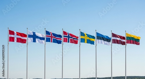  the flags of Nordic and Baltic countries waving together in the air, including Norway, Sweden, Finland, Denmark, Iceland, Estonia, Latvia and Lithuania