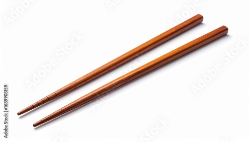 A pair of wooden chopsticks on a clean white backdrop, shot with a diagonal perspective.