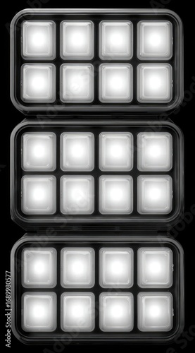 A stack of three rectangular trays, each with eight rounded-square, glowing inserts, all against a black background, creating a geometric pattern