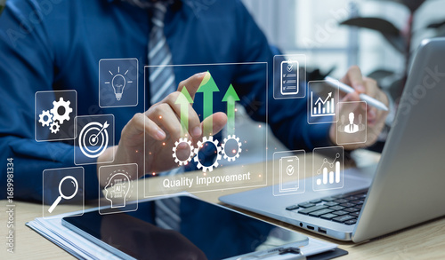 Tableau sur toile Quality and process improvement concept with businessman solving problems, enhancing organizational processes, implementing continuous improvement, and boosting industrial management efficiency