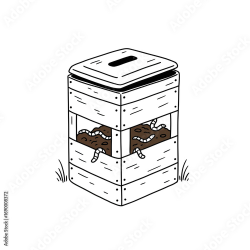A wooden worm composting bin with worms visible inside, surrounded by grass.