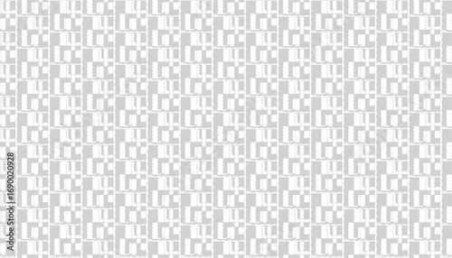 Repeating geometric pattern of white rectangles with jagged edges on a light gray background