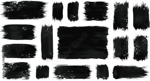 A collection of black grunge brush strokes, textured paint daubs, and ink stains isolated on white.