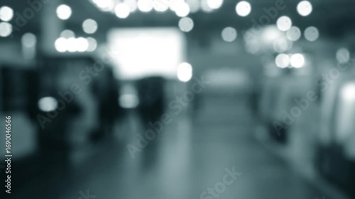 Wallpaper Mural People walking in building. Building with walls, floor, ceiling illuminated lamps. Silhouettes of people indoors. Many people walking. Men and women in tall hall. Exhibition center. Blurred background Torontodigital.ca