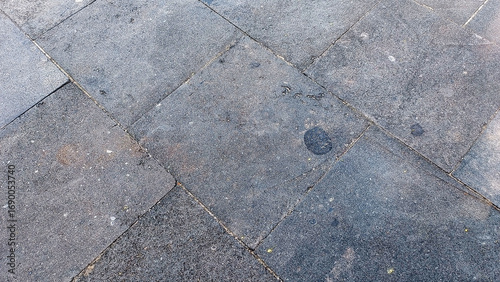 Old gray concrete pavement with stains