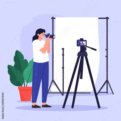 Photographer capturing images with camera in studio setup for professional photography.