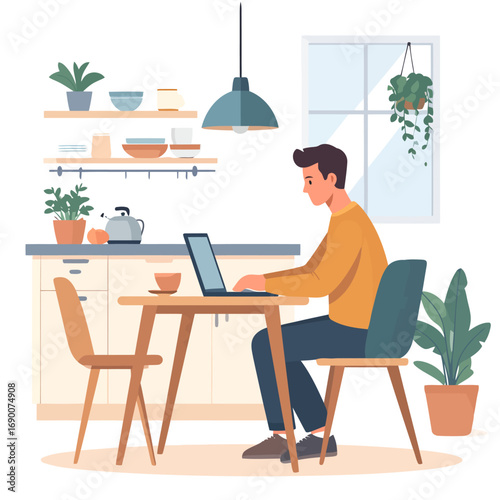 Man working on laptop at kitchen table in a bright, modern home.