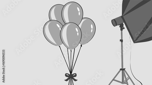 Studio photography setup with balloons gray background party decoration light equipment graphic design element festive illustration celebration image.