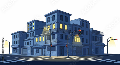 Quiet city street at night with illuminated buildings and traffic lights.