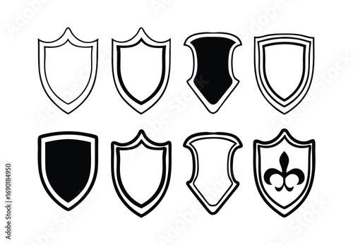 Collection of eight decorative shield icons in outline and filled styles heraldry symbols