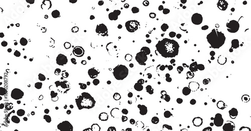 Artistic black ink splatters and droplets on white creating dynamic abstract composition