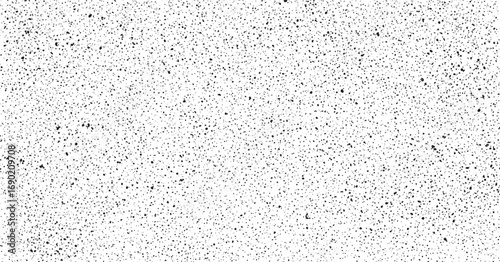 Dense fine grained monochrome dotted noise texture on white minimal abstract design