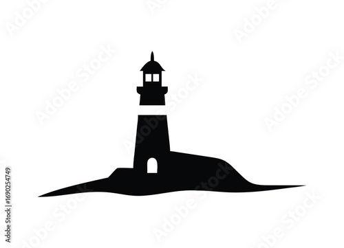 Silhouette of a tall lighthouse standing on a rocky island coastline