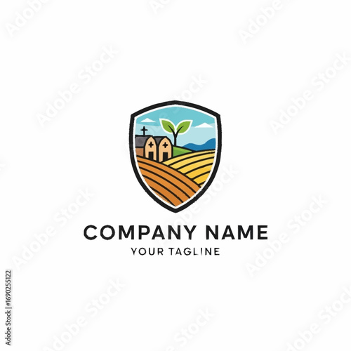 A modern shield logo depicting a rural farm scene with a barn, cultivated fields, and a green sprout.
