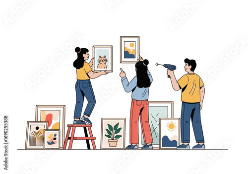 Three people hanging artwork using a drill and stepping stool. Suitable for home improvement, diy, teamwork, creativity, home decor concepts.