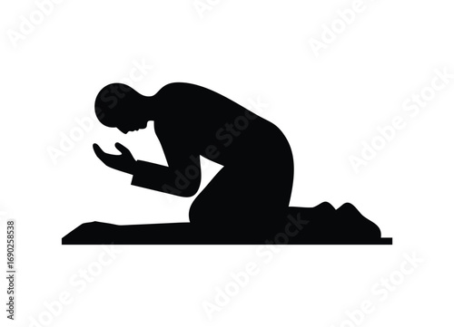 Silhouette of a person praying in a humble pose down on knees with hands up