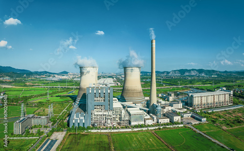 Canvastavla Panoramic view of a modern thermal power plant complex with a tall chimney and cooling towers