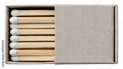 Close up of a matchbox with several matches inside in a horizontal view