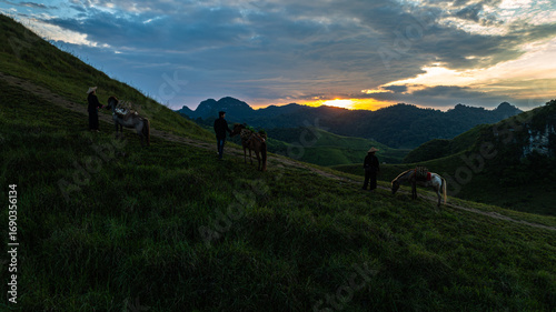Slika na platnu Dawn on the high mountain peaks of Ha Lang area, with pack horses and people going to work