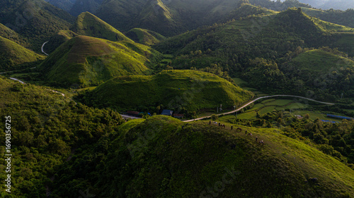 Fotografija Dawn on the high mountain peaks of Ha Lang area, with pack horses and people going to work