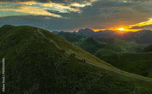 Slika na platnu Dawn on the high mountain peaks of Ha Lang area, with pack horses and people going to work