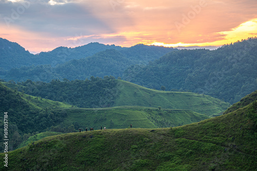 Slika na platnu Dawn on the high mountain peaks of Ha Lang area, with pack horses and people going to work